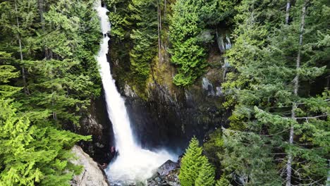 Aerial-pullback-shot-of-Silver-Falls-waterfall-in-British-Columbia,-Canada