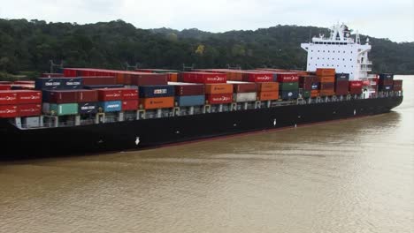 Container-carrier-ship--crossing-Gatun-Lake,-Panama-Canal
