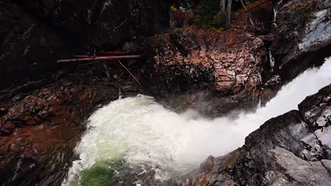 Slow-motion-aerial-view-of-waterfall-at-Nairn-Falls-Park-in-British-Columbia,-Canada