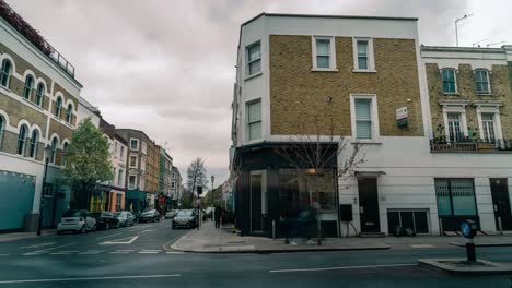 Time-lapse-shot-of-cars-driving-on-road-during-cloudy-day-in-Notting-Hill-district-of-London