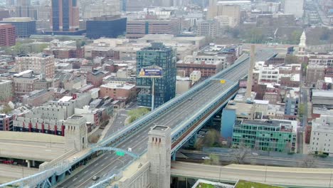 Aerial-view-overlooking-quiet-Ben-Franklin-Bridge-and-intestate-95,-in-Philadelphia