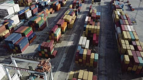 Aerial-view-of-colorful-cargo-containers-waiting-in-pandemic-lockdown-at-Vigo-port