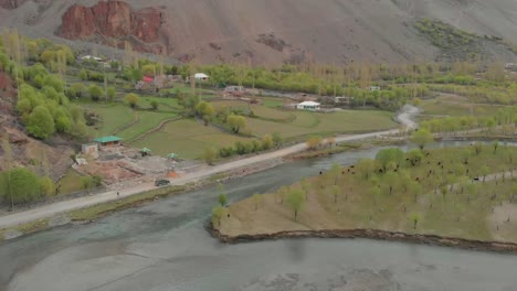 Aerial-Above-Ghizer-River-With-SUV-Parked-On-Rural-Road