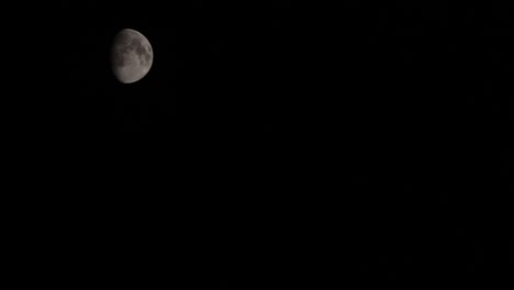 Timelapse-View-Of-Waxing-Gibbous-Phase-Of-Moon-Passing-Against-Black-Night-Sky