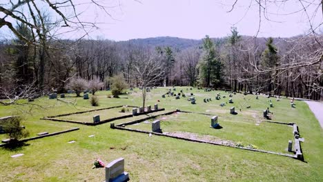 Tombstones-through-tree-branches-aerial-in-nc-graveyard-and-cemetery