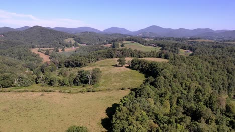 Snake-Mountain-in-background-with-pastureland-in-foreground,-snake-mountain-nc,-snake-mountain-north-carolina-near-boone-and-blowing-rock-nc,-north-carolina-in-watauga-county-nc,-north-carolina