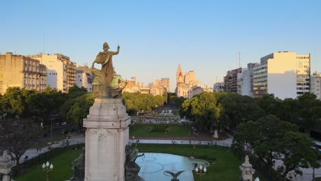 Aerial-orbit-of-bronze-monument-in-Congressional-Plaza-near-Argentine-Congress-building-at-sunsetBuenos-Aires