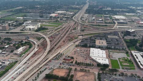 Birds-eye-view-of-traffic-on-610-and-59-South-freeway-in-Houston,-Texas