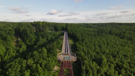 Antique-wooden-train-tracks-at-Kinzua-Bridge-State-Park-in-Pennsylvania-in-the-Allegheny-National-Forest-drone-front-of-bridge-shot