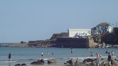 Coverack-Beach-In-Summer-With-Tourists-Playing-And-Stand-up-Paddling