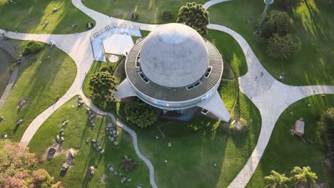 Aerial-high-angle-over-Galileo-Galilei-Planetarium-in-Palermo-Woods-at-daytime,-Buenos-Aires