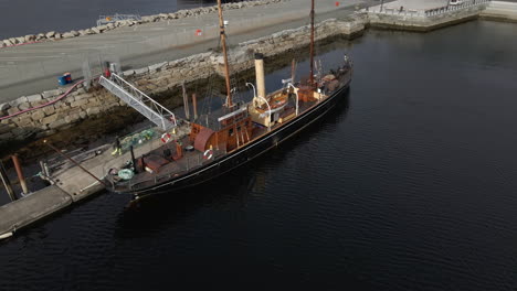 Old-Wooden-Boat-Moored-At-Harbour-By-Trondheim-Fjord-In-Central-Norway
