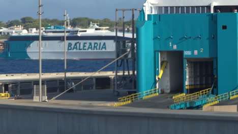 Fast-Ferry-of-the-Balearia-company-entering-slowly-in-the-harbor-of-Ciutadella-in-Menorca-during-summer-2021