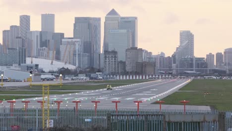 Airport-security-cars-drive-up-and-down-London-City-airport-runway