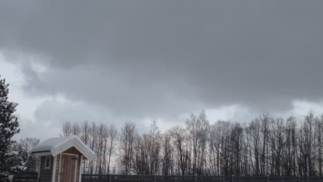 Moving-clouds-over-winter-landscape.-Time-lapse
