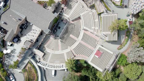 Aerial-view-rotating-above-the-empty-concert-bowl,-at-the-mountain-winery-in-Saratoga---top-down,-drone-shot
