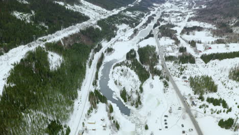 Snowy-Landscape-By-The-Mountains-In-Haugastol-Norway-On-A-Beautiful-Winter-Day--aerial-shot