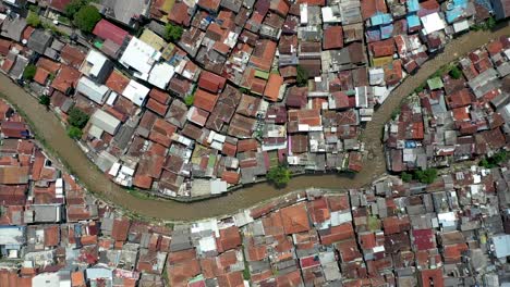 Residential-water-canal-in-Bandung-city-near-Pasupati-bridge,-West-Java-Indonesia,-Aerial-pan-right-shot