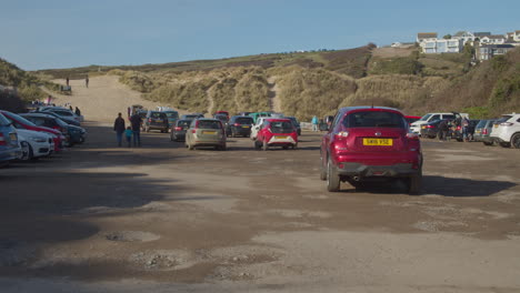 Families-arriving-on-full-parking-lot-by-Crantock-Beach-on-sunny-day