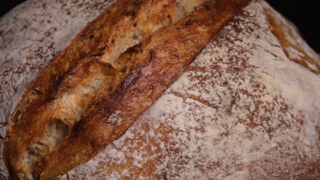 Close-Up-Of-Freshly-Baked-Sourdough-Bread,-Revealing-Light-To-Dark