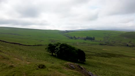 Drone-footage-of-Peak-District-National-park-near-Whaley-Bridge,-England,-Uk---showing-rolling-landscape-and-few-trees-on-the-uplands