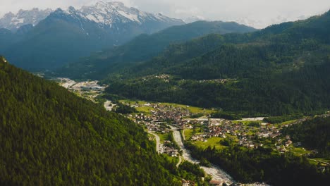 Aerial-view-over-Taibon-Agordino-village-in-Veneto-among-Dolomite-mountains,-Italy