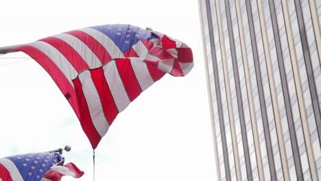 Single-American-Flag-Hung-Horizontally-Flowing-In-The-Wind-In-New-York-City,-USA