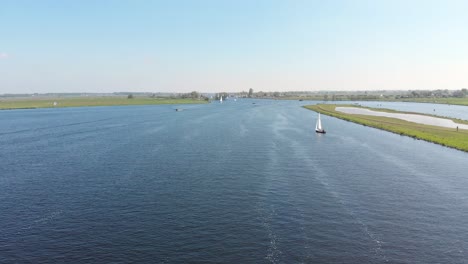 Aerial-view-of-sailboats-on-Kaag-Lakes,-Netherlands,-sunny-summer-day