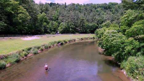 Aerial-Push-over-Fly-Fisherman-along-the-New-River-in-Watauga-County-NC,-Watauga-County-North-Carolina-near-Boone-NC