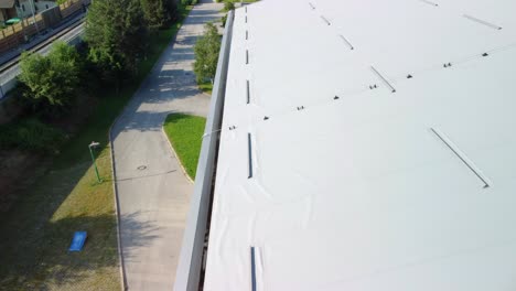 Flying-over-thermal-insulation-roof-panels-with-metal-sheet-gutter-at-side