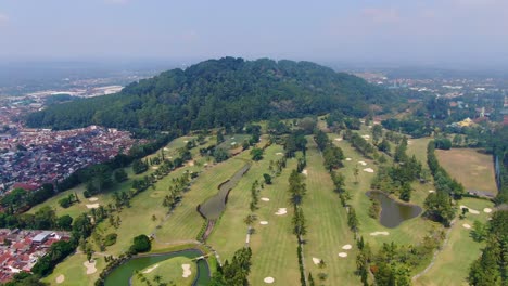 Grandest-golf-course-in-Magelang,-Indonesia.-Aerial-forward