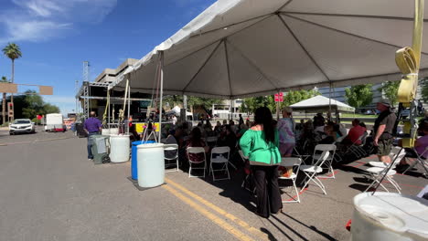 People-Watching-A-Live-Band-Playing-During-The-Tucson-Meet-Yourself-Folklife-Festival-In-Tucson-City,-Arizona