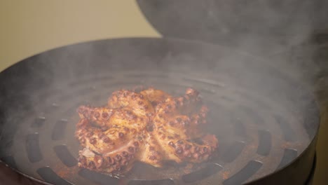 Cinematic-slow-motion-shot-of-a-smoky-octopus-on-the-grill-smoker,-perfectly-cooked-with-golden-brown-crispy-outside,-atmosphere-full-of-aromatic-smokes