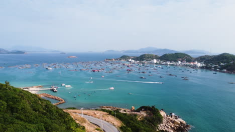Slow-pan-right-shot-of-Binh-Hung-coast-with-boats-on-sunny-day,-Vietnam