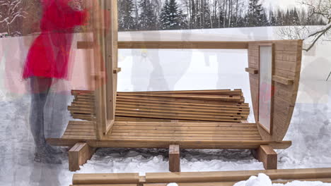 Wooden-Sauna-Being-Built-On-Snowy-Rural-Landscape-During-Winter-Season
