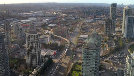 Vancouver-Skytrain-Moving-Past-Brentwood-Station-In-Burnaby-Canada--aerial-shot