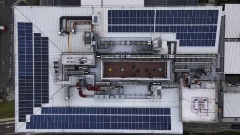 Top-down-aerial-shot-of-solar-panels-on-the-roof-of-a-building-in-San-Jose
