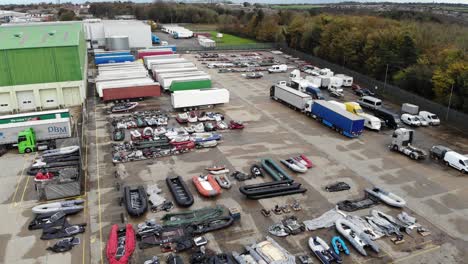 Drone-footage-showing-confiscated-migrant-boats-being-stored-in-a-storage-facility-close-to-Dover-in-Kent,-UK