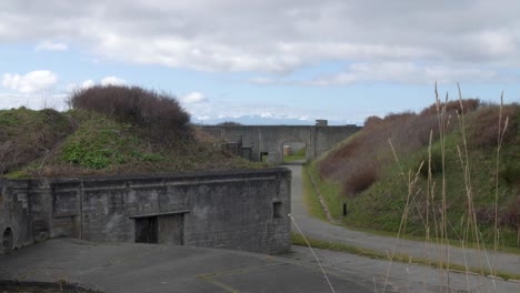 Wide-establishing-sliding-shot-of-Fort-Casey's-abandoned-military-bunkers-on-Whidbey-Island