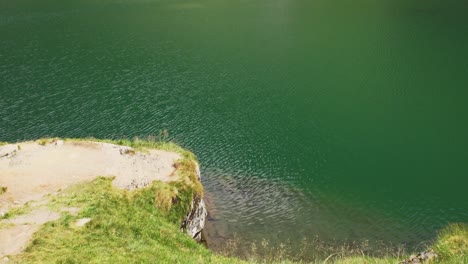 Emerald-Calm-Water-Of-Balea-Lake-Revealed-Steep-Rocky-Valley-Near-Transfagaras-In-Romania