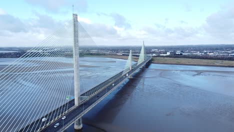 Mersey-gateway-landmark-aerial-view-above-toll-suspension-bridge-river-crossing-reverse-descent-shot