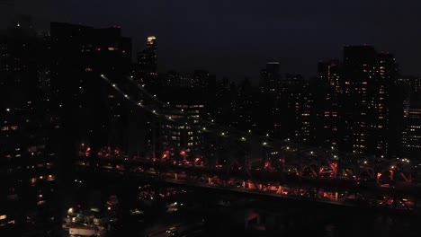 Aerial-shot-moves-closer-to-the-Queensboro-59th-Street-Bridge-in-New-York-City-at-twilight