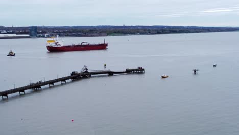 Silver-Rotterdam-oil-petrochemical-shipping-tanker-leaving-Tranmere-terminal-Liverpool-aerial-view-descending-pull-away