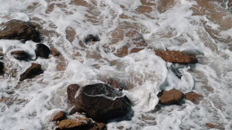 Ocean-Waves-Crashing-Over-Rocks-On-Beach-At-Balochistan