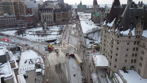 Freedom-convoy-truckers-protest-in-downtown-Ontario-Canada-aerial-view-down-public-road