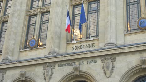 Sorbonne-University-Building's-Flags-At-Primary-Entrance-On-The-Rue-Des-Ecoles-In-The-Latin-Quarter-Of-Paris,-France