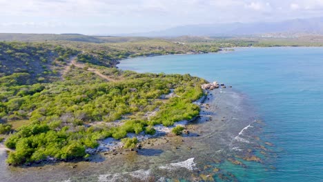 Aerial-View-of-Playa-Monte-Rio,-Azua,-Rugged-Beautiful-Coastline,-Coral-Reef-and-Turquoise-Blue-Ocean-in-Dominican-Republic-closing-Shot