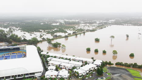 Aerial-view-of-the-QLD-Floods-coming-very-close-to-houses-next-to-CBUS-Stadium-Robina-Gold-Coast-QLD-Australia