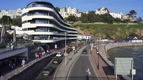 Torquay-main-sea-front-road-on-a-busy-day-with-a-modern-hotel-and-traffic