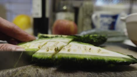 Chef-slices-Kerala-bitter-melon-into-smaller-pieces-in-his-kitchen